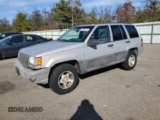 1998 Jeep Grand Cherokee Laredo with VIN 1J4GZ58S1WC195986, listed as a Copart auction lot 87188215 with 151,052 mi miles and Clean title. Bid and sale history available at DreamBid. Image 1.