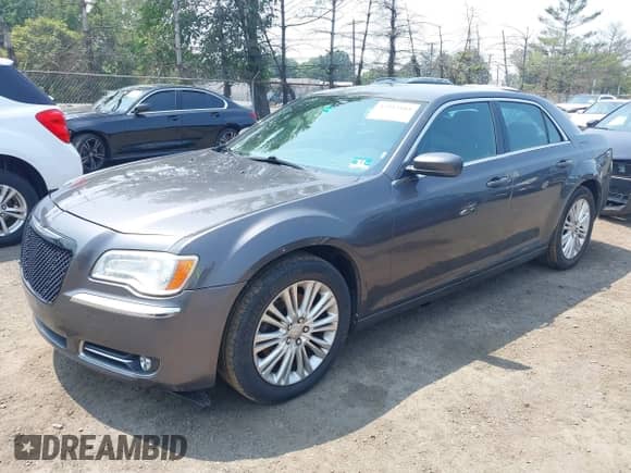 2014 Chrysler 300 with VIN 2C3CCARG0EH136503, listed as a IAAI auction lot 42913881 with 208,364 mi miles and . Bid and sale history available at DreamBid. Image 2.