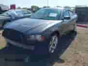 2014 Dodge Charger SE with VIN 2C3CDXBG2EH364318, listed as a IAAI auction lot 43365253 with 105,597 mi miles and . Bid and sale history available at DreamBid. Image 2.