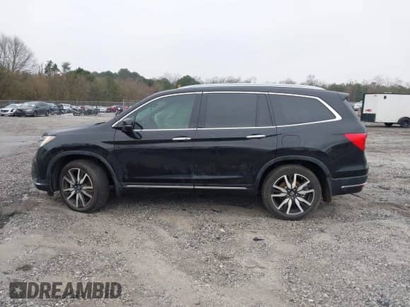 2022 Honda Pilot Touring 7-Passenger z VIN 5FNYF5H61NB013372, wystawiony jako IAAI lot #41595890 z przebiegiem 53 664 mil mil oraz . Historia ofert i sprzedaży dostępna na DreamBid. Obrazek 14.