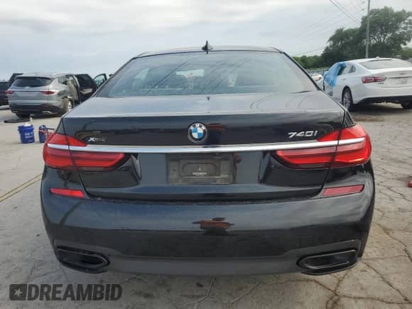 2019 BMW 7 Series 740i xDrive with VIN WBA7E4C55KGV70002, listed as a Copart auction lot 66395815 with 128,606 mi miles and Salvage title. Bid and sale history available at DreamBid. Image 6.