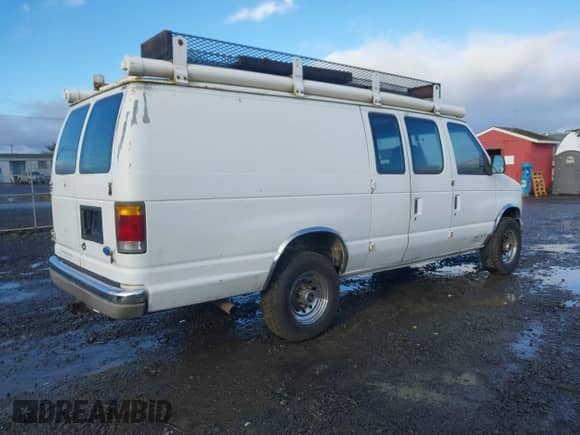 1992 Ford Econoline Cargo with VIN 1FTHS24H5NHB42507, listed as a IAAI auction lot 41512347 with 373,987 mi miles and . Bid and sale history available at DreamBid. Image 4.