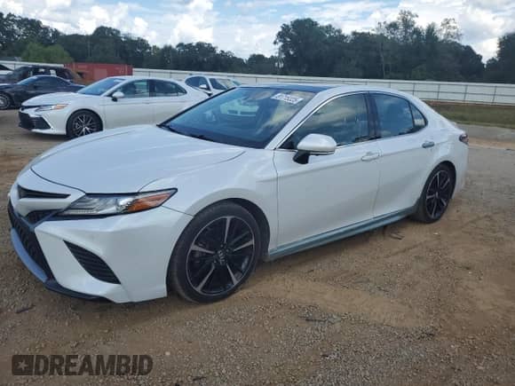2018 Toyota Camry XSE с VIN 4T1B61HKXJU083834, выставлен на аукционе Copart как лот 81715325 с пробегом 132 140 миль миль и Списание • Salvage title. История ставок и продаж доступна на DreamBid. Изображение 1.