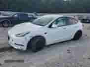 2022 Tesla Model Y Long Range with VIN 7SAYGDEE3NF355041, listed as a Copart auction lot 69226925 with 15,558 mi miles and Salvage title. Bid and sale history available at DreamBid. Image 1.