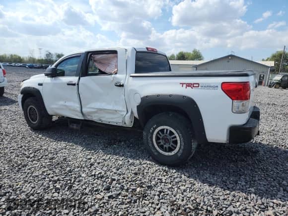 2011 Toyota Tundra with VIN 5TFDW5F10BX185268, listed as a Copart auction lot 85114585 with 143,651 mi miles and Salvage title. Bid and sale history available at DreamBid. Image 2.