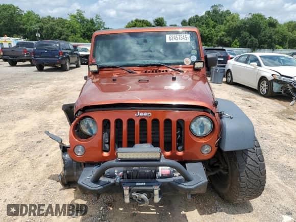 2014 Jeep Wrangler Rubicon with VIN 1C4BJWCG7EL221506, listed as a Copart auction lot 62457345 with 69,606 mi miles and Salvage title. Bid and sale history available at DreamBid. Image 5.