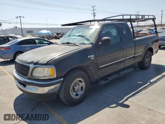 1998 Ford F-150 with VIN 1FTZX1763WKA58006, listed as a Copart auction lot 57264195 with 273,690 mi miles and Salvage title. Bid and sale history available at DreamBid. Image 1.