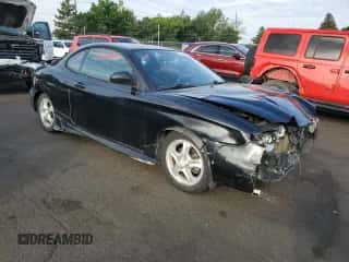 2001 Hyundai Tiburon с VIN KMHJG25F21U250094, выставлен на аукционе Copart как лот 58390024 с пробегом 175 615 миль миль и Списание • Salvage title. История ставок и продаж доступна на DreamBid. Изображение 4.