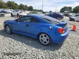 2004 Hyundai Tiburon GT z VIN KMHHN65F44U133018, wystawiony jako Copart lot #71449834 z przebiegiem 142 777 mil mil oraz Szkoda całkowita • Salvage title. Historia ofert i sprzedaży dostępna na DreamBid. Obrazek 2.