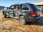 2009 Jeep Grand Cherokee with VIN 1J8HR68T19C550936, listed as a Copart auction lot 80090724 with 113,543 mi miles and Salvage title. Bid and sale history available at DreamBid. Image 2.