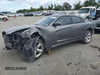 2012 Dodge Charger SXT z VIN 2C3CDXHG6CH126234, wystawiony jako Copart lot #70297715 z przebiegiem 142 644 mil mil oraz Szkoda całkowita • Salvage title. Historia ofert i sprzedaży dostępna na DreamBid. Obrazek 1.