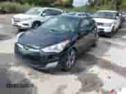 2012 Hyundai Veloster w/Gray Int z VIN KMHTC6AD6CU049429, wystawiony jako IAAI lot #43410430 z przebiegiem 153 050 mil mil oraz . Historia ofert i sprzedaży dostępna na DreamBid. Obrazek 2.