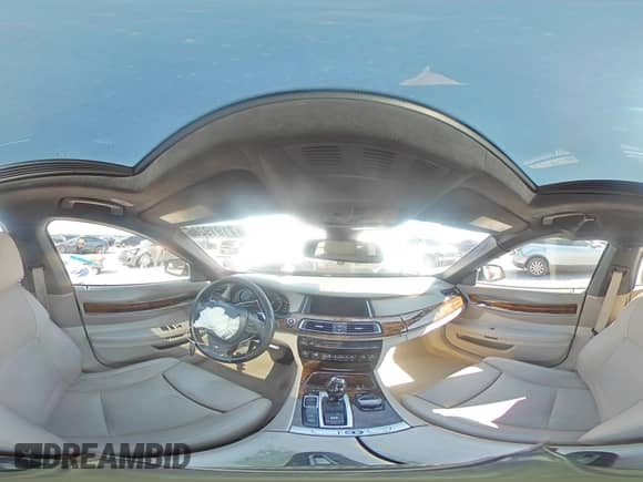 2015 BMW 7 Series 750i с VIN WBAYA8C51FG197604, выставлен на аукционе Copart как лот 71919285 с пробегом 165 914 миль миль и Списание • Salvage title. История ставок и продаж доступна на DreamBid. Изображение 15.