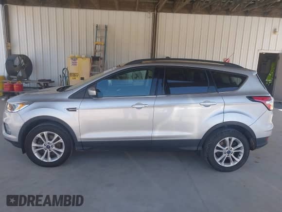 2018 Ford Escape SE with VIN 1FMCU9GDXJUC62452, listed as a IAAI auction lot 43119355 with 117,966 mi miles and . Bid and sale history available at DreamBid. Image 15.