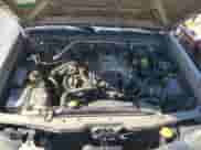 2004 Nissan Frontier XE Desert Runner with VIN 1N6ED26Y24C429693, listed as a Copart auction lot 52411095 with 216,430 mi miles and Salvage title. Bid and sale history available at DreamBid. Image 13.