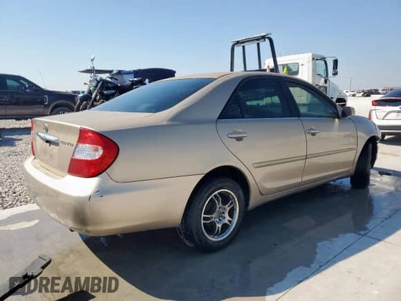 2003 Toyota Camry XLE с VIN 4T1BE32K33U125786, выставлен на аукционе Copart как лот 84923995 с пробегом 287 877 миль миль и Списание • Salvage title. История ставок и продаж доступна на DreamBid. Изображение 3.