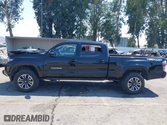 2023 Toyota Tacoma SR5 z VIN 3TMDZ5BN7PM148621, wystawiony jako IAAI lot #42928723 z przebiegiem 70 708 mil mil oraz . Historia ofert i sprzedaży dostępna na DreamBid. Obrazek 14.