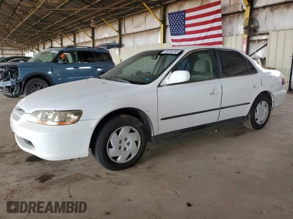 1999 Honda Accord LX with VIN 1HGCG1642XA007708, listed as a Copart auction lot 45334245 with 206,343 mi miles and Clean title. Bid and sale history available at DreamBid. Image 1.