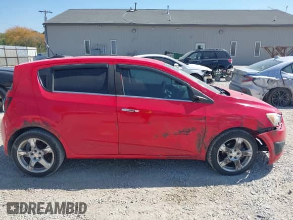 2015 Chevrolet Sonic LTZ with VIN 1G1JE6SBXF4103136, listed as a IAAI auction lot 43264836 with 138,290 mi miles and . Bid and sale history available at DreamBid. Image 12.
