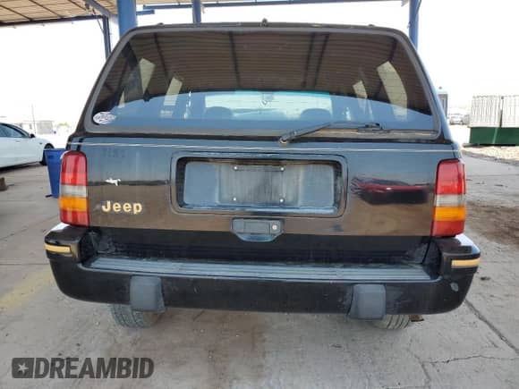 1994 Jeep Grand Cherokee Limited z VIN 1J4GZ78S5RC304501, wystawiony jako Copart lot #64632335 z przebiegiem 184 333 mil mil oraz Szkoda całkowita • Salvage title. Historia ofert i sprzedaży dostępna na DreamBid. Obrazek 6.