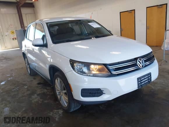 2013 Volkswagen Tiguan with VIN WVGCV3AX7DW605594, listed as a IAAI auction lot 42057457 with 131,629 mi miles and . Bid and sale history available at DreamBid. Image 1.