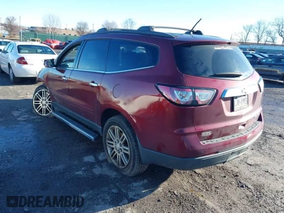 2015 Chevrolet Traverse LT with VIN 1GNKRGKD5FJ101424, listed as a IAAI auction lot 41211081 with 130,639 mi miles and . Bid and sale history available at DreamBid. Image 3.