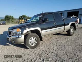 2003 GMC Sierra 1500 SLT with VIN 2GTEK19T031155644, listed as a Copart auction lot 71902745 with 142,466 mi miles and Salvage title. Bid and sale history available at DreamBid. Image 1.