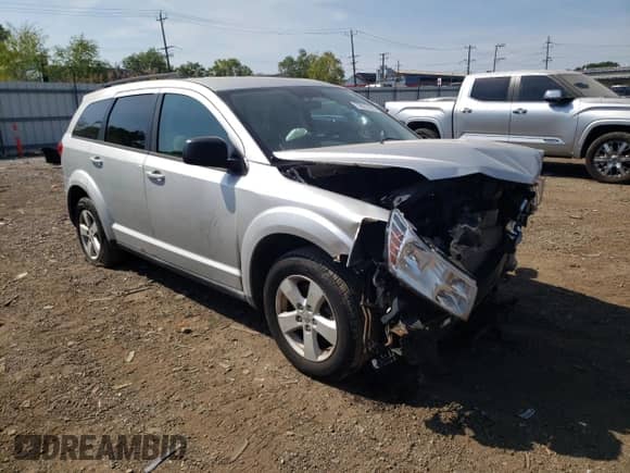 2013 Dodge Journey SE с VIN 3C4PDCAB1DT555262, выставлен на аукционе Copart как лот 70923105 с пробегом 186 222 миль миль и Списание • Salvage title. История ставок и продаж доступна на DreamBid. Изображение 4.
