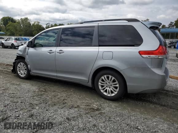 2013 Toyota Sienna XLE AAS with VIN 5TDYK3DC0DS401067, listed as a Copart auction lot 84659005 with 208,465 mi miles and Salvage title. Bid and sale history available at DreamBid. Image 2.