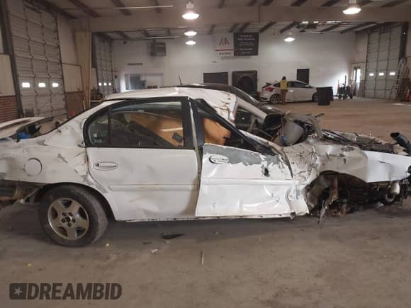 2004 Chevrolet Malibu Classic z VIN 1G1ND52F04M699548, wystawiony jako IAAI lot #41358609 z przebiegiem Nie podano mil oraz . Historia ofert i sprzedaży dostępna na DreamBid. Obrazek 13.