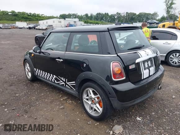 2009 MINI Hardtop with VIN WMWMF33539TW76329, listed as a IAAI auction lot 42512079 with 94,865 mi miles and . Bid and sale history available at DreamBid. Image 3.