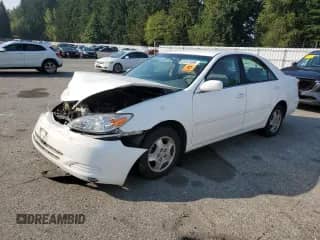 2002 Toyota Camry LE with VIN 4T1BF32K92U026322, listed as a Copart auction lot 83767695 with Not provided miles and Salvage title. Bid and sale history available at DreamBid. Image 1.