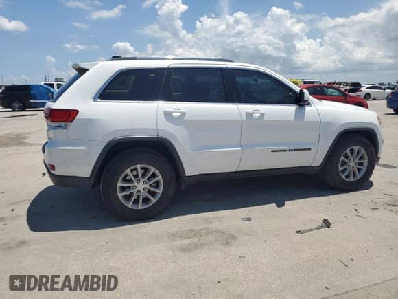 2021 Jeep Grand Cherokee Laredo E with VIN 1C4RJEAG9MC682295, listed as a Copart auction lot 65734825 with 111,495 mi miles and Salvage title. Bid and sale history available at DreamBid. Image 3.