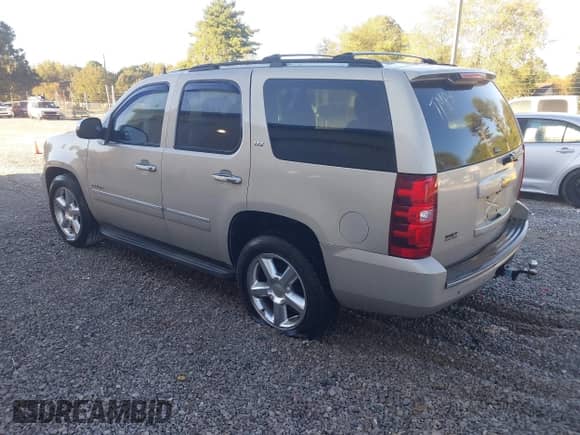 2011 Chevrolet Tahoe LTZ with VIN 1GNSCCE06BR334632, listed as a IAAI auction lot 43493090 with 166,769 mi miles and . Bid and sale history available at DreamBid. Image 3.