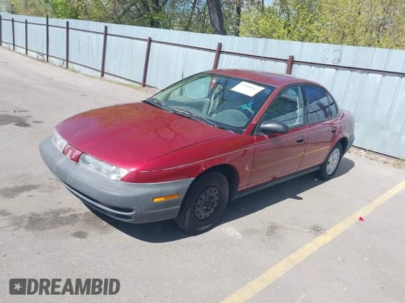 1996 Saturn SL z VIN 1G8ZG5289TZ214790, wystawiony jako IAAI lot #42090262 z przebiegiem 197 485 mil mil oraz . Historia ofert i sprzedaży dostępna na DreamBid. Obrazek 2.