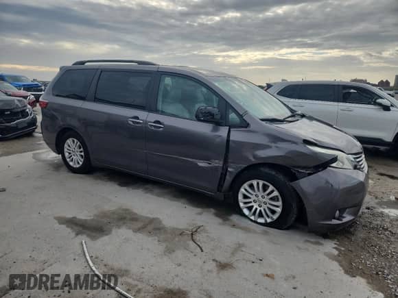 2015 Toyota Sienna XLE with VIN 5TDYK3DC0FS635339, listed as a Copart auction lot 84868955 with 181,129 mi miles and Salvage title. Bid and sale history available at DreamBid. Image 4.