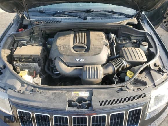 2014 Jeep Grand Cherokee Laredo with VIN 1C4RJEAG7EC282267, listed as a Copart auction lot 68341225 with 166,805 mi miles and Salvage title. Bid and sale history available at DreamBid. Image 12.