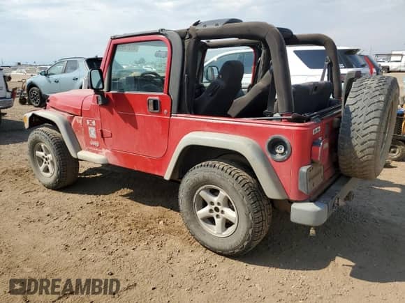 2003 Jeep Wrangler X z VIN 1J4FA39S33P308881, wystawiony jako Copart lot #69323655 z przebiegiem 264 257 mil mil oraz Szkoda całkowita • Salvage title. Historia ofert i sprzedaży dostępna na DreamBid. Obrazek 2.
