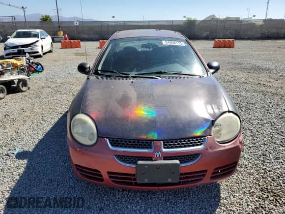 2004 Dodge Neon SXT with VIN 1B3ES56C14D505687, listed as a Copart auction lot 84958115 with 211,385 mi miles and Salvage title. Bid and sale history available at DreamBid. Image 5.