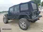 2007 Jeep Wrangler Unlimited Rubicon with VIN 1J4GA69117L112867, listed as a Copart auction lot 59909565 with 166,963 mi miles and Salvage title. Bid and sale history available at DreamBid. Image 2.