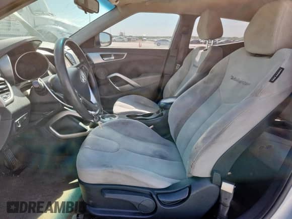 2012 Hyundai Veloster w/Red Int z VIN KMHTC6ADXCU036716, wystawiony jako Copart lot #63408115 z przebiegiem 144 117 mil mil oraz Szkoda całkowita • Salvage title. Historia ofert i sprzedaży dostępna na DreamBid. Obrazek 7.