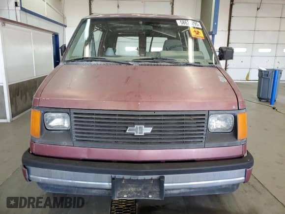 1985 Chevrolet Astro z VIN 1GCDM15N6FB158114, wystawiony jako Copart lot #58625295 z przebiegiem 97 643 mil mil oraz Czysty tytuł • Clean title. Historia ofert i sprzedaży dostępna na DreamBid. Obrazek 5.
