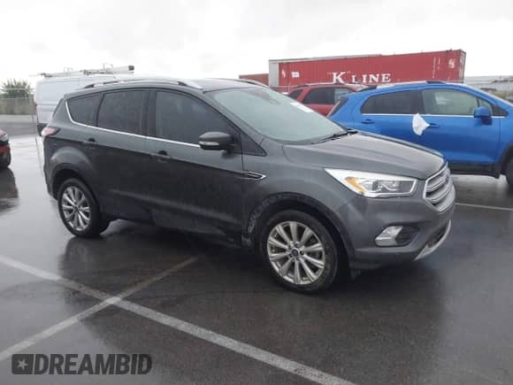 2017 Ford Escape Titanium with VIN 1FMCU9JD5HUC55301, listed as a IAAI auction lot 43359577 with 199,607 mi miles and . Bid and sale history available at DreamBid. Image 1.