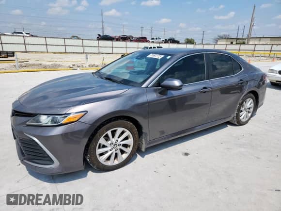 2021 Toyota Camry LE с VIN 4T1C11AK9MU587650, выставлен на аукционе Copart как лот 70694115 с пробегом 273 975 миль миль и Списание • Salvage title. История ставок и продаж доступна на DreamBid. Изображение 1.