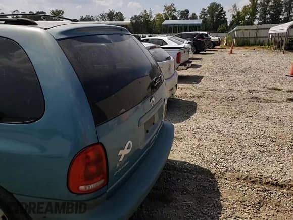 1999 Dodge Caravan SE z VIN 2B4GP44G3XR423211, wystawiony jako Copart lot #69094794 z przebiegiem 158 050 mil mil oraz Szkoda całkowita • Salvage title. Historia ofert i sprzedaży dostępna na DreamBid. Obrazek 11.