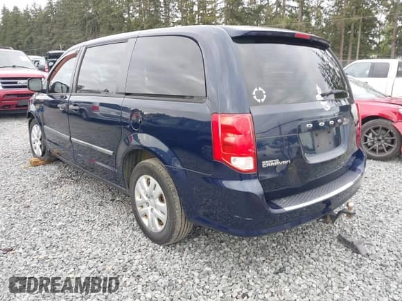 2014 Dodge Grand Caravan SE with VIN 2C4RDGBG0ER187249, listed as a IAAI auction lot 42143078 with 119,097 mi miles and . Bid and sale history available at DreamBid. Image 3.