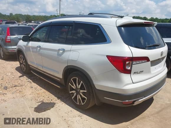 2022 Honda Pilot Touring 8-Passenger with VIN 5FNYF5H96NB004676, listed as a IAAI auction lot 42636581 with 23,428 mi miles and . Bid and sale history available at DreamBid. Image 3.