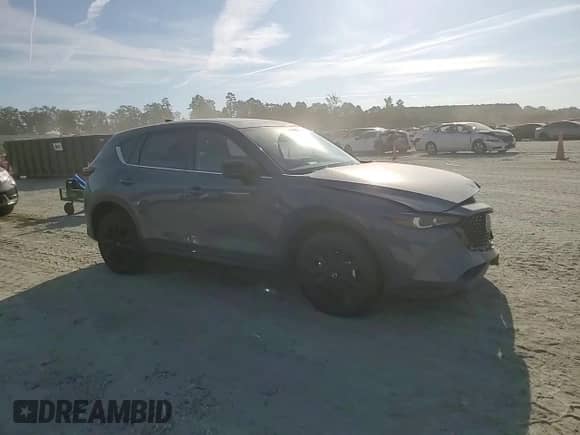 2023 Mazda CX-5 S Carbon Edition с VIN JM3KFBCM6P0179020, выставлен на аукционе Copart как лот 70706485 с пробегом 30 675 миль миль и Списание • Salvage title. История ставок и продаж доступна на DreamBid. Изображение 14.