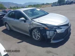2021 Toyota Camry LE with VIN 4T1C11AK2MU538371, listed as a IAAI auction lot 42860035 with 90,662 mi miles and . Bid and sale history available at DreamBid. Image 1.