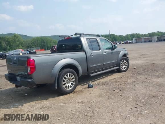 2009 Nissan Frontier SE with VIN 1N6AD09W19C407379, listed as a IAAI auction lot 42494543 with 209,680 mi miles and . Bid and sale history available at DreamBid. Image 4.